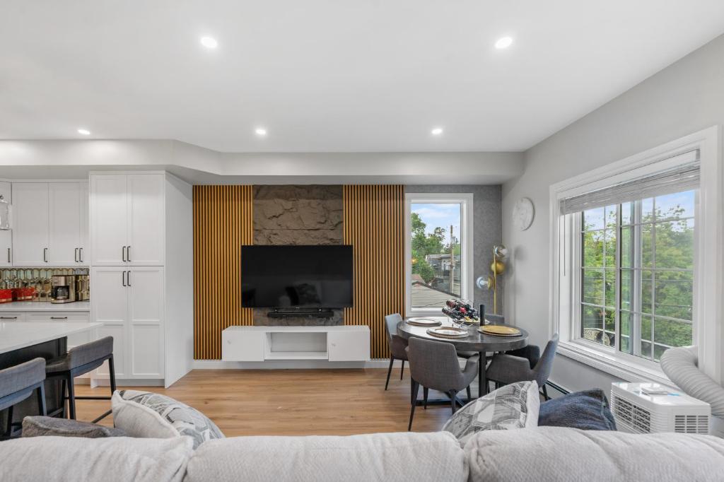 a living room with a couch and a table at Casa Ladrillo - House of Bricks in Calgary