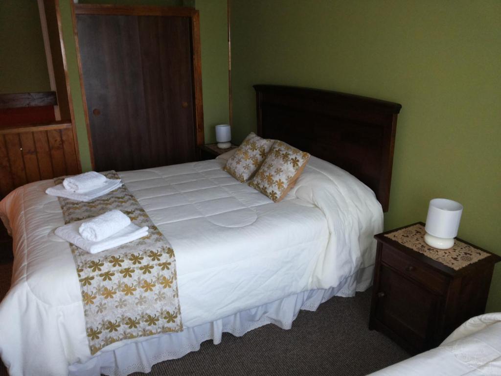 Postel nebo postele na pokoji v ubytování VALYAK rent apart hotel - Servicios Integrales