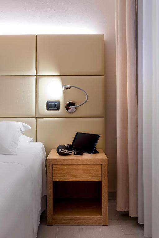 Postel nebo postele na pokoji v ubytování Best Western Cavalieri Della Corona