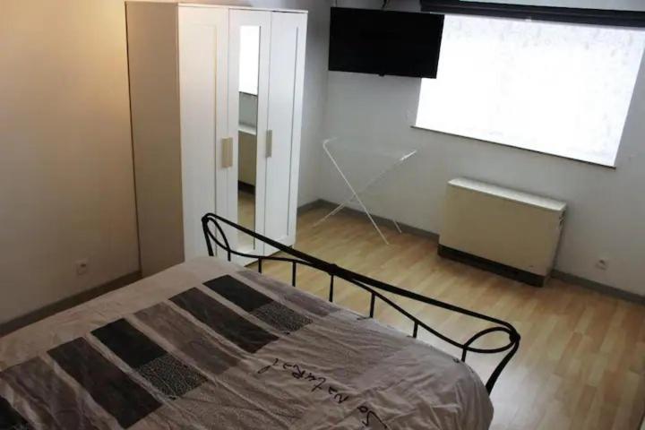 Postel nebo postele na pokoji v ubytování L'appart de Visé