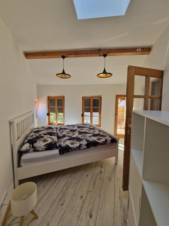 Postel nebo postele na pokoji v ubytování Dům s duší