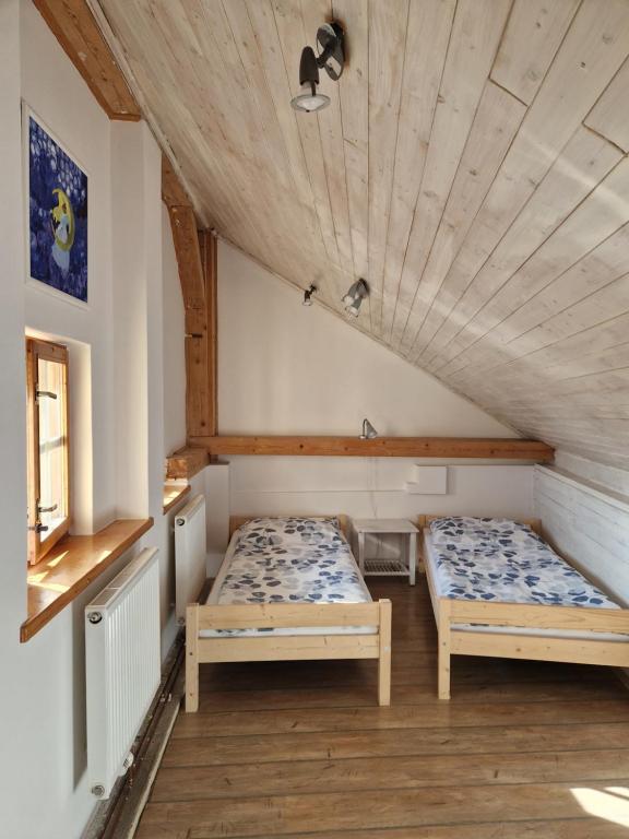 Postel nebo postele na pokoji v ubytování Dům s duší