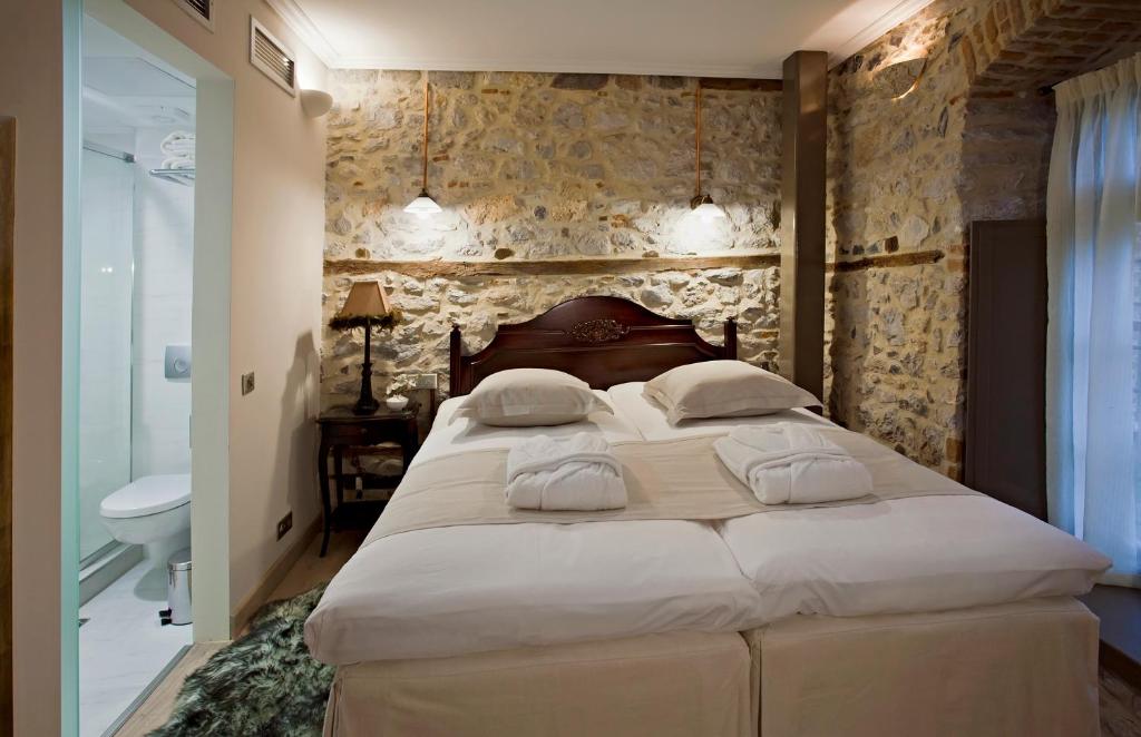 Postel nebo postele na pokoji v ubytování Hotel Doltso