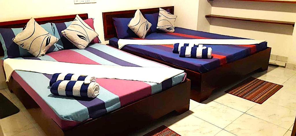 Postel nebo postele na pokoji v ubytování Lilly Rooms