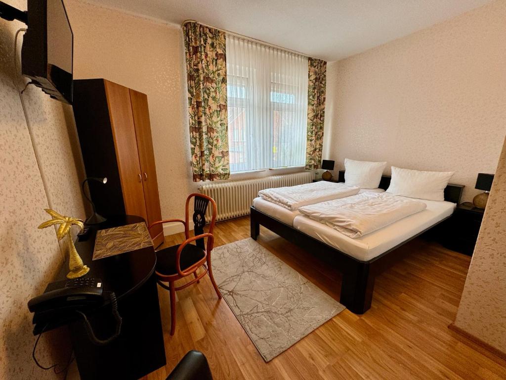 Postel nebo postele na pokoji v ubytování Hotel Sophien-Café