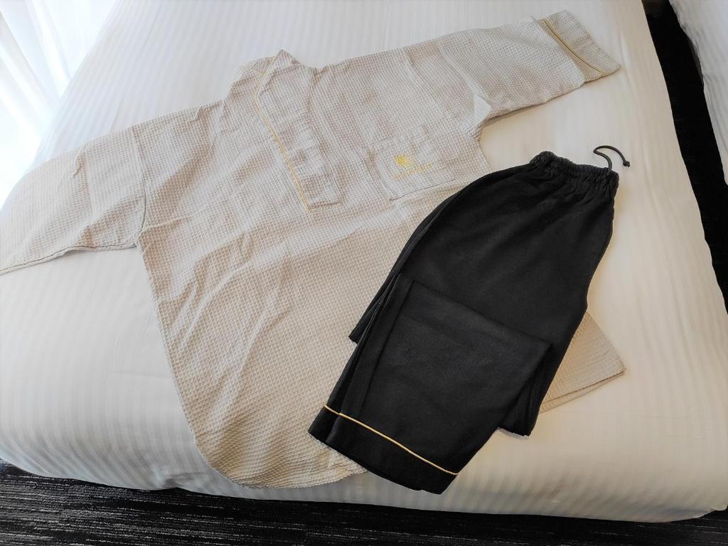 Postel nebo postele na pokoji v ubytování ALA HOTEL KYOTO