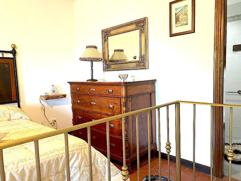 Postel nebo postele na pokoji v ubytování Il Castello Di Perchia