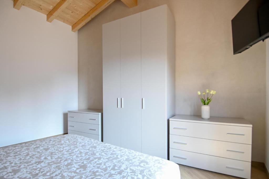 Postel nebo postele na pokoji v ubytování La Corte di Scanzo - Luxury and Charm