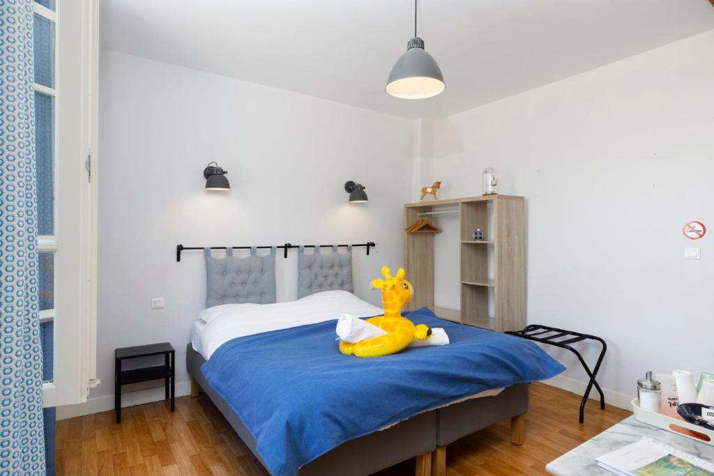 Postel nebo postele na pokoji v ubytování Le Grand Bassin