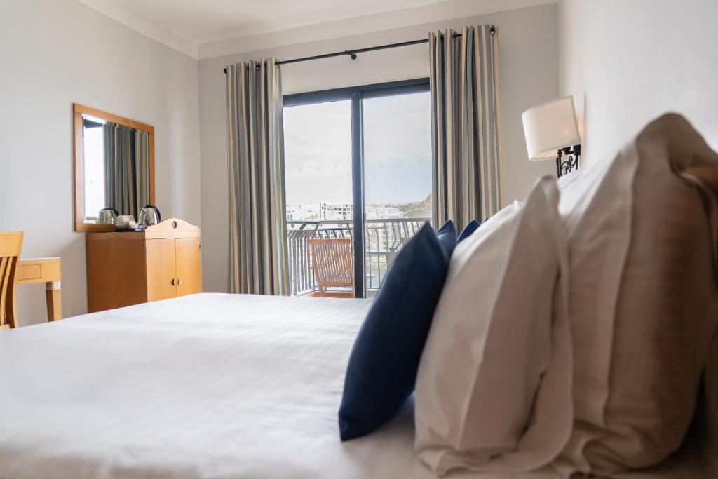 Posteľ alebo postele v izbe v ubytovaní Hotel Calypso