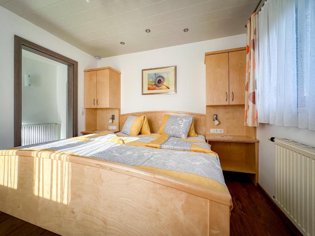 Postel nebo postele na pokoji v ubytování Gästehaus im Wiesengrund