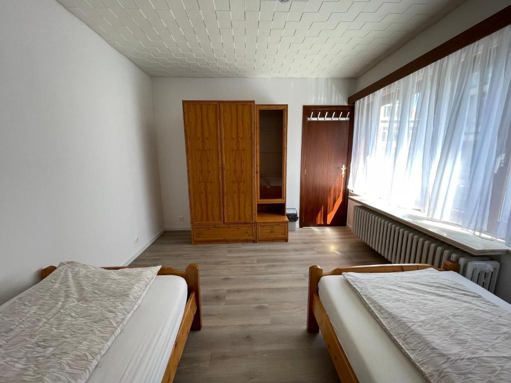 Postel nebo postele na pokoji v ubytování Gasthaus A&S - Oostende - Beach