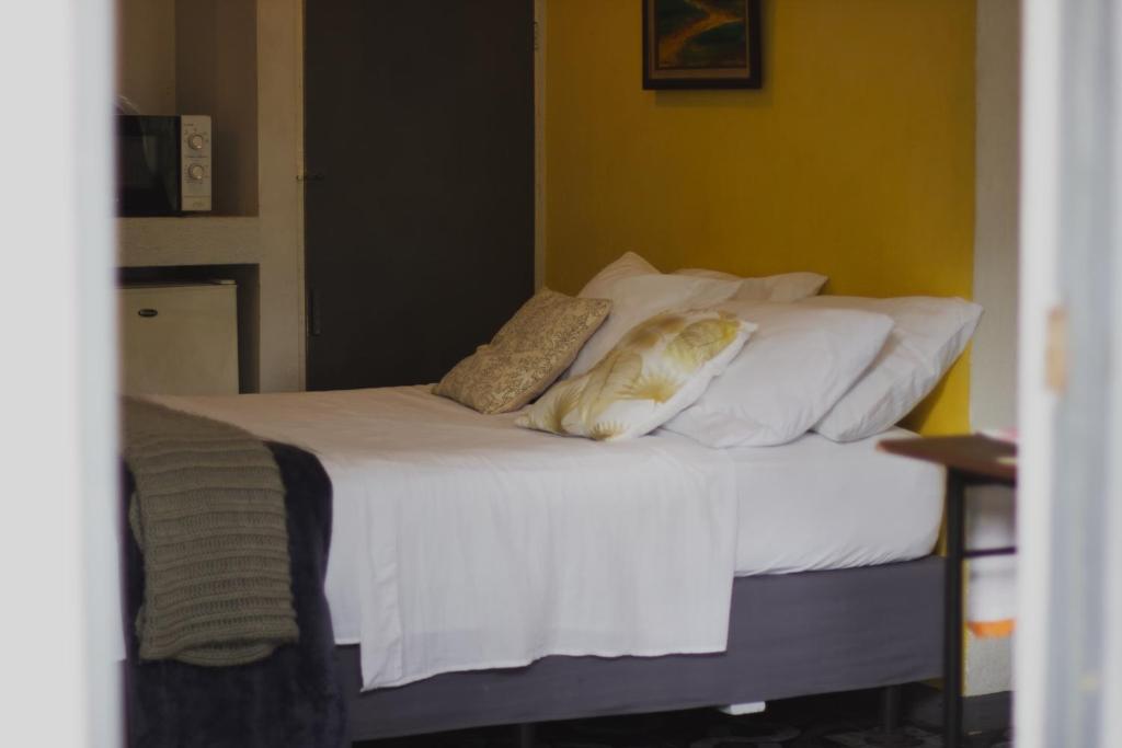 Postel nebo postele na pokoji v ubytování blanc haus
