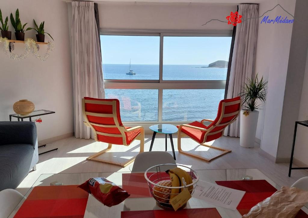 a living room with a view of the ocean at MarMédano Apartamento 3 in El Médano