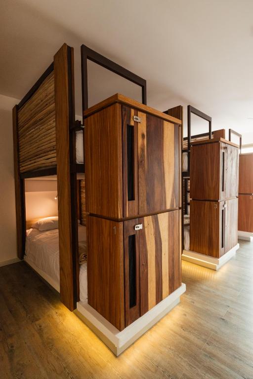 Postel nebo postele na pokoji v ubytování SUUT Hostal Boutique
