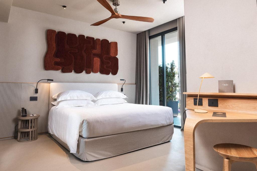 Ein Bett oder Betten in einem Zimmer der Unterkunft Capitolo Riviera