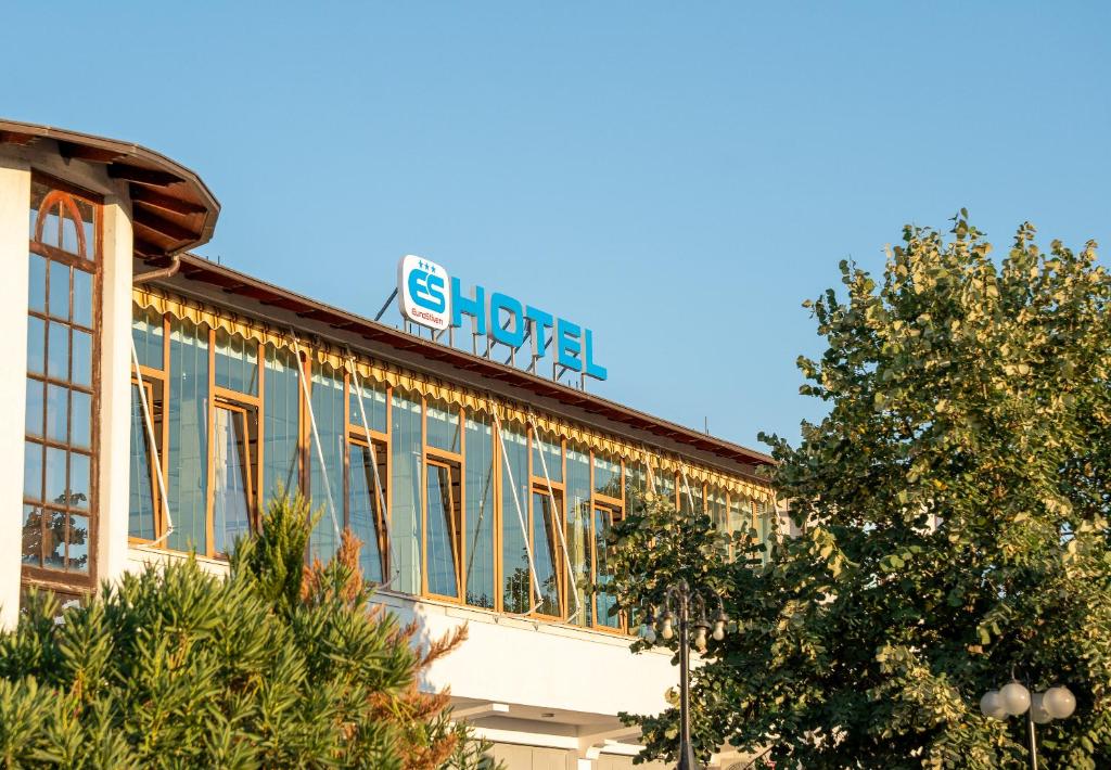 a building with a sign on top of it at Hotel EuroStiven in Shkodër