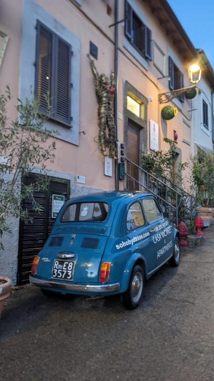 a blue car parked in front of a building at SOHO Borgonovo by Dasso - Case Vacanze e Appartamenti in Viterbo