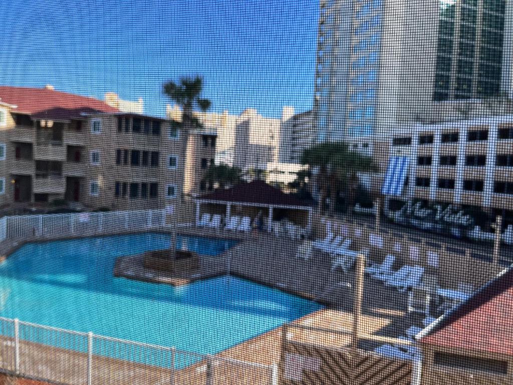 a view of a swimming pool in a city at Cherry Grove condo just steps from the ocean in Myrtle Beach