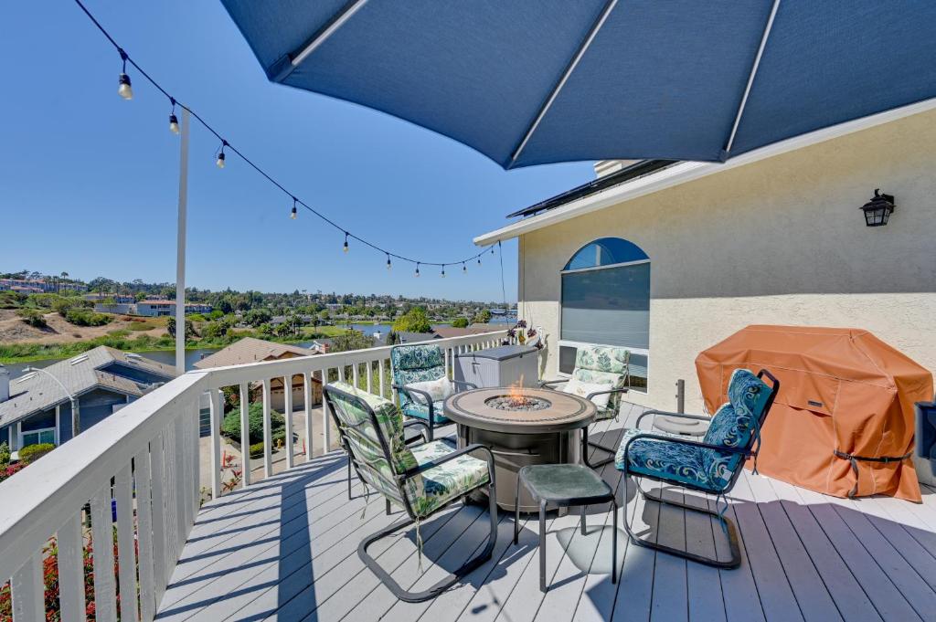 a patio with chairs and a table on a balcony at San Marcos Getaway with Deck and Lake Views! in San Marcos