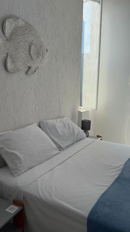 Postel nebo postele na pokoji v ubytování Casa das Tartarugas