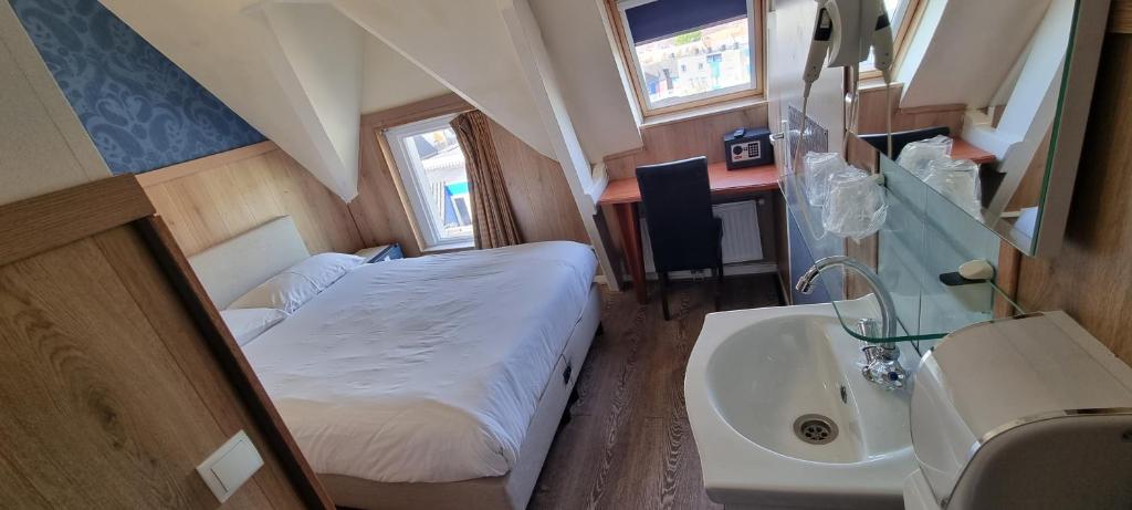 Postel nebo postele na pokoji v ubytování Hotel Isis