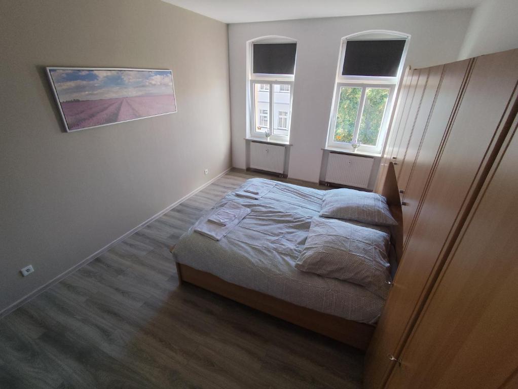 Postel nebo postele na pokoji v ubytování Cocon Zeitz