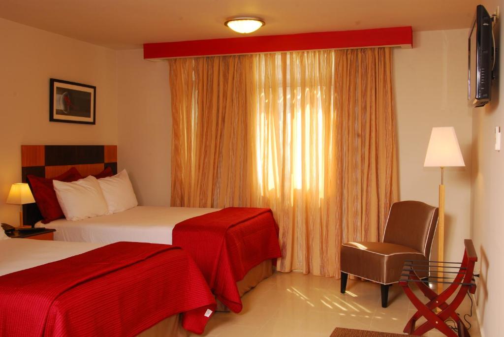 Postel nebo postele na pokoji v ubytování Metro Hotel Panama