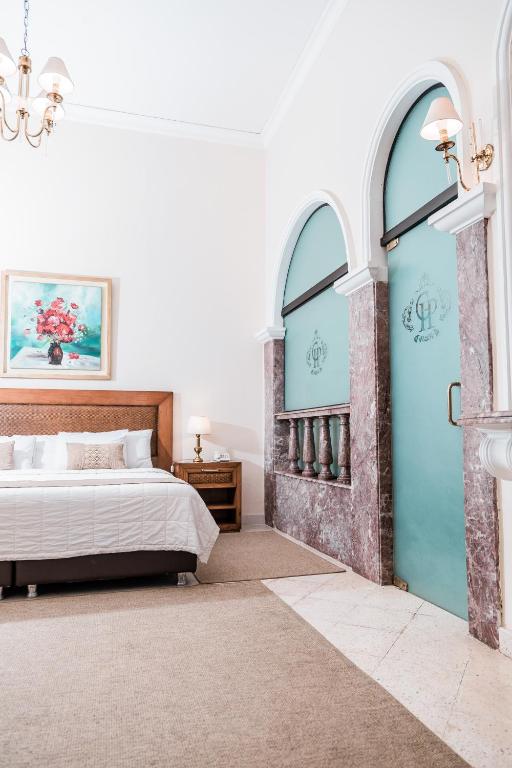 Postel nebo postele na pokoji v ubytování Gran Hotel del Paraguay