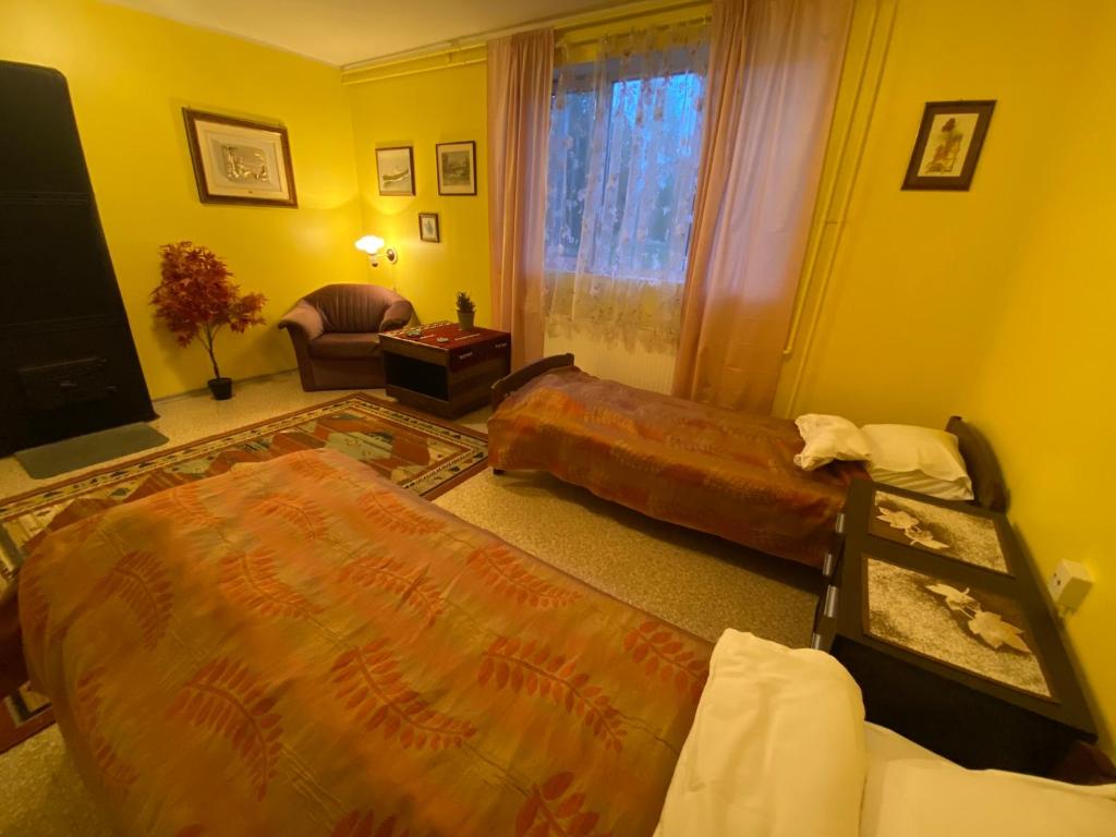 Postel nebo postele na pokoji v ubytování Torgu Royal Guesthouse