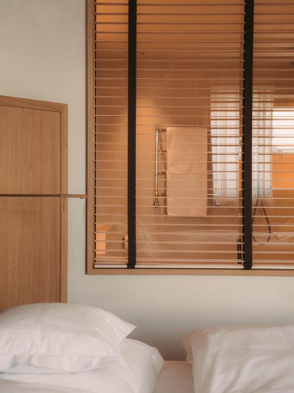 Postel nebo postele na pokoji v ubytování Hotel Schwarzwand