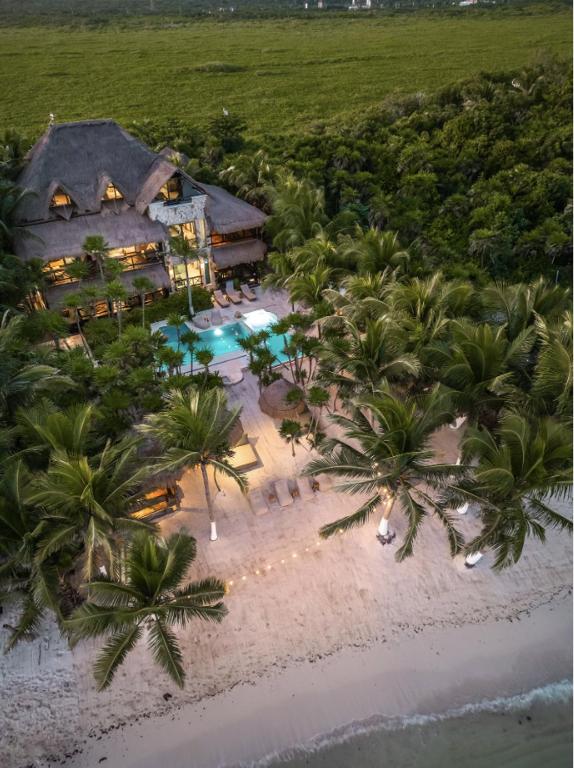 an aerial view of a resort on the beach at Casa de Los Vientos Soliman Bay in Tulum