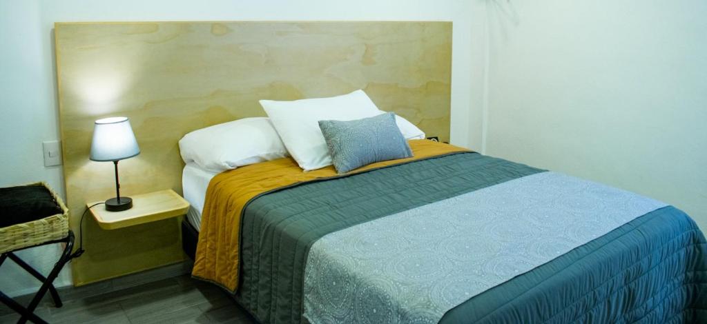 Postel nebo postele na pokoji v ubytování Hotel Ciclovía & Terraza