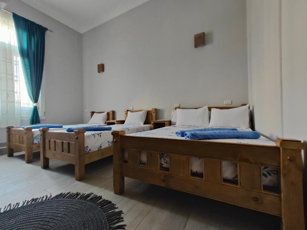 Postel nebo postele na pokoji v ubytování Champollion Palace