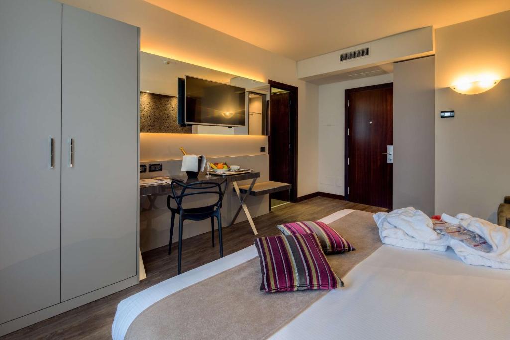 Łóżko lub łóżka w pokoju w obiekcie Best Western Plus Hotel Farnese