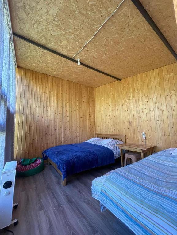 Postel nebo postele na pokoji v ubytování Mountain House in Juta