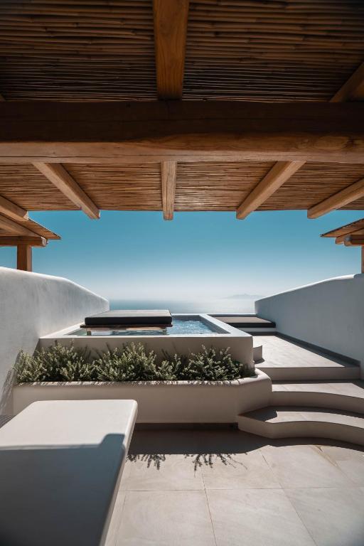 Posezení v ubytování NĒRO Suites by NOMÉE Hospitality Group