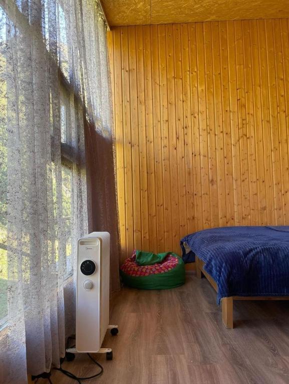 Postel nebo postele na pokoji v ubytování Mountain House in Juta