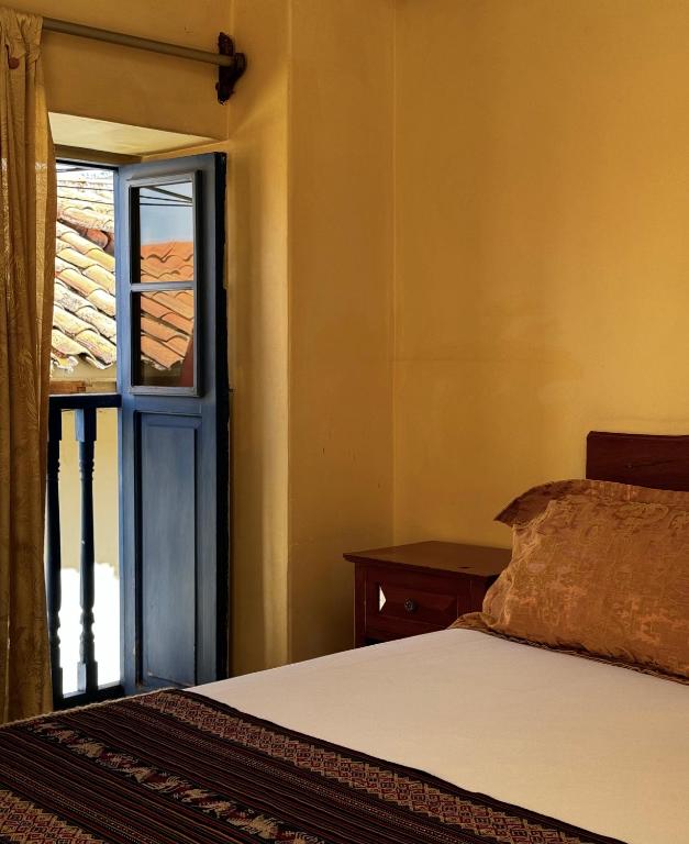Rúm í herbergi á Huascaran Casa Boutique San Blas