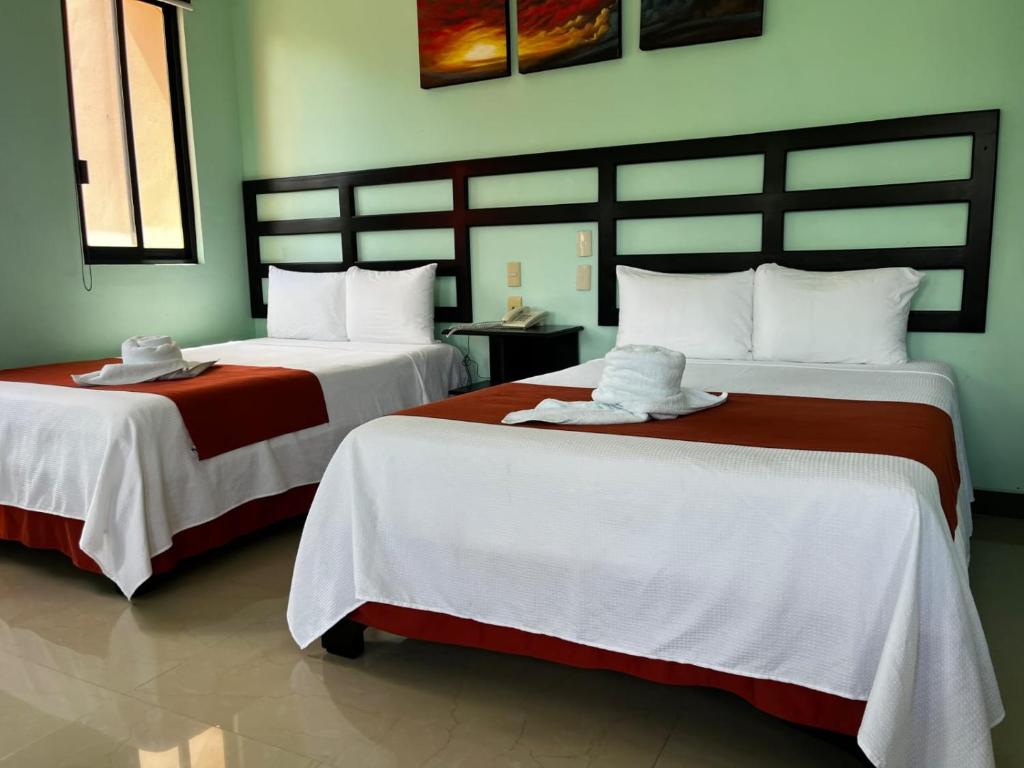 Postel nebo postele na pokoji v ubytování Hotel Castillo Del Rey