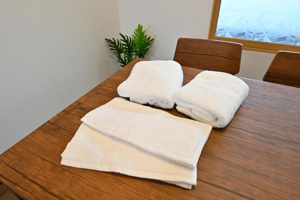 Postel nebo postele na pokoji v ubytování 天然温泉付きの一棟貸切 ペットOk 無料駐車場有 最大10名