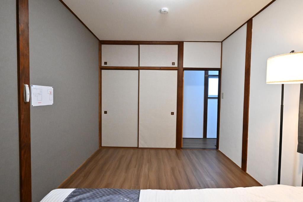 Postel nebo postele na pokoji v ubytování 天然温泉付きの一棟貸切 ペットOk 無料駐車場有 最大10名