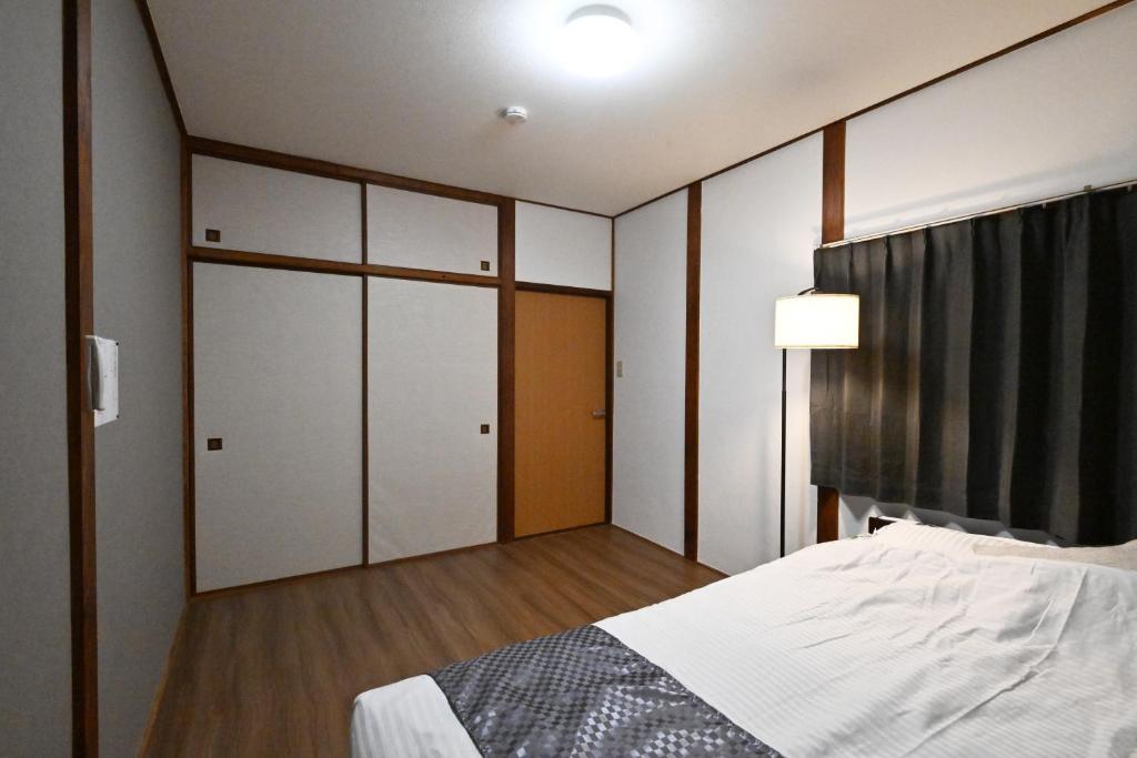 Postel nebo postele na pokoji v ubytování 天然温泉付きの一棟貸切 ペットOk 無料駐車場有 最大10名
