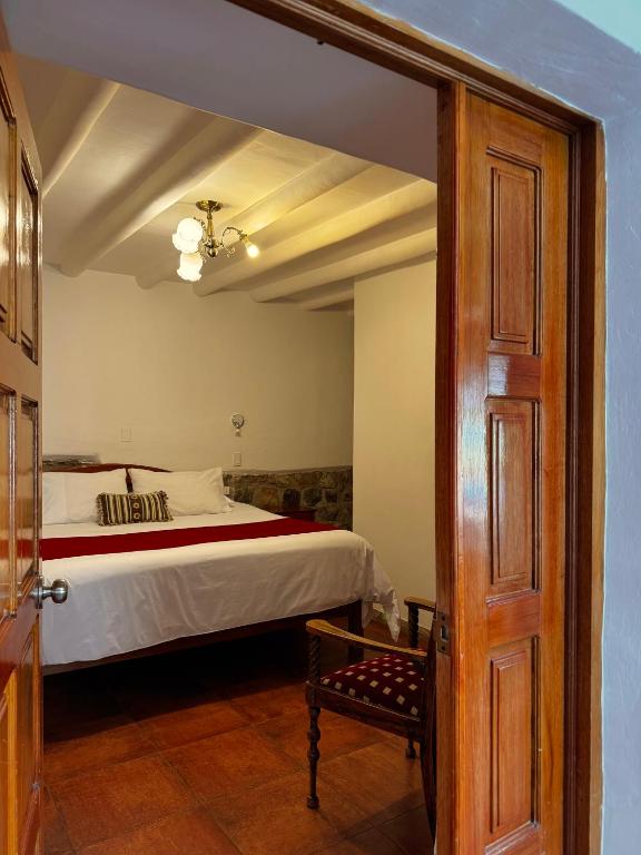 Rúm í herbergi á Huascaran Casa Boutique San Blas