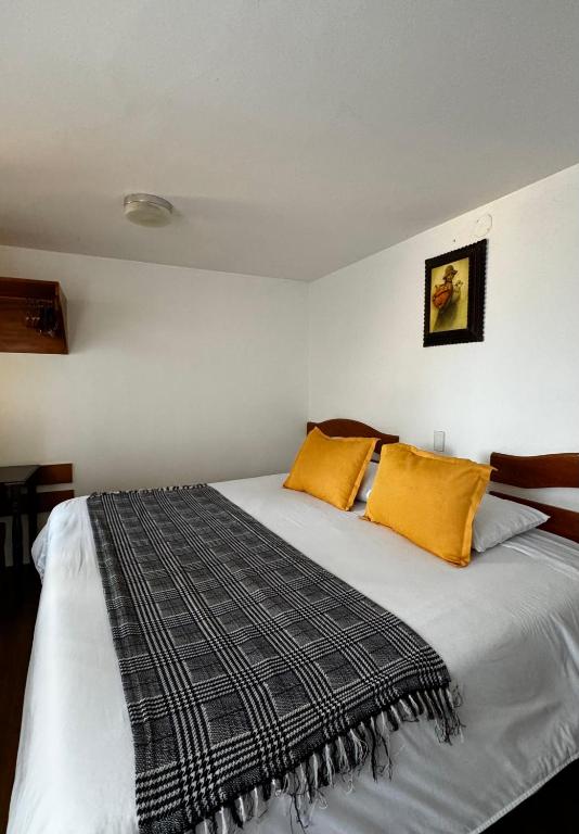 Rúm í herbergi á Huascaran Casa Boutique San Blas