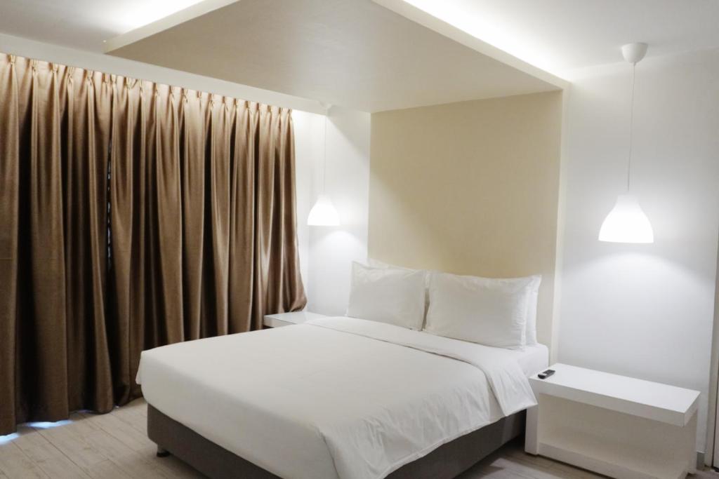 Postel nebo postele na pokoji v ubytování LeBlanc Hotel