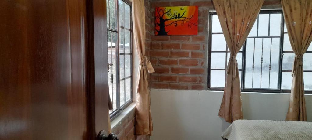 Postel nebo postele na pokoji v ubytování Tranquilidad en el campo