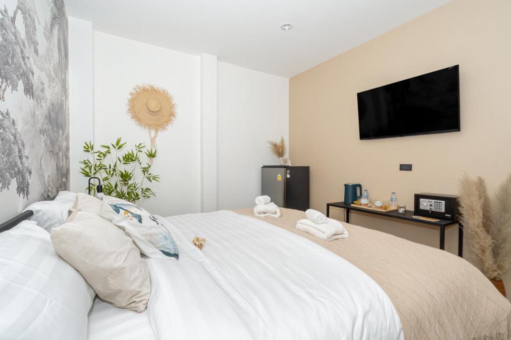 Postel nebo postele na pokoji v ubytování Mitsu Guesthouse