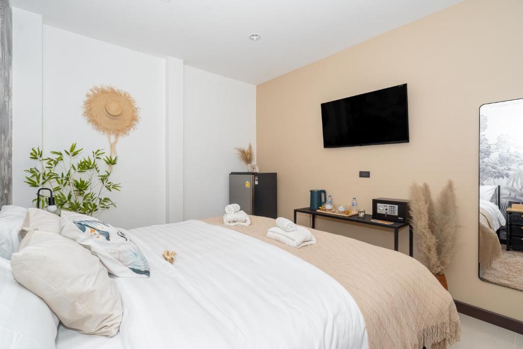 Postel nebo postele na pokoji v ubytování Mitsu Guesthouse