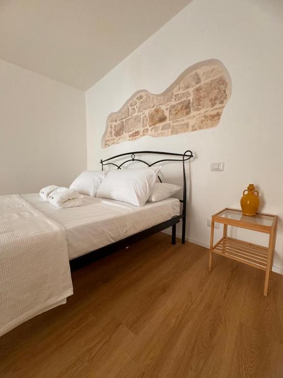 Postel nebo postele na pokoji v ubytování Borgo Sant Angelo